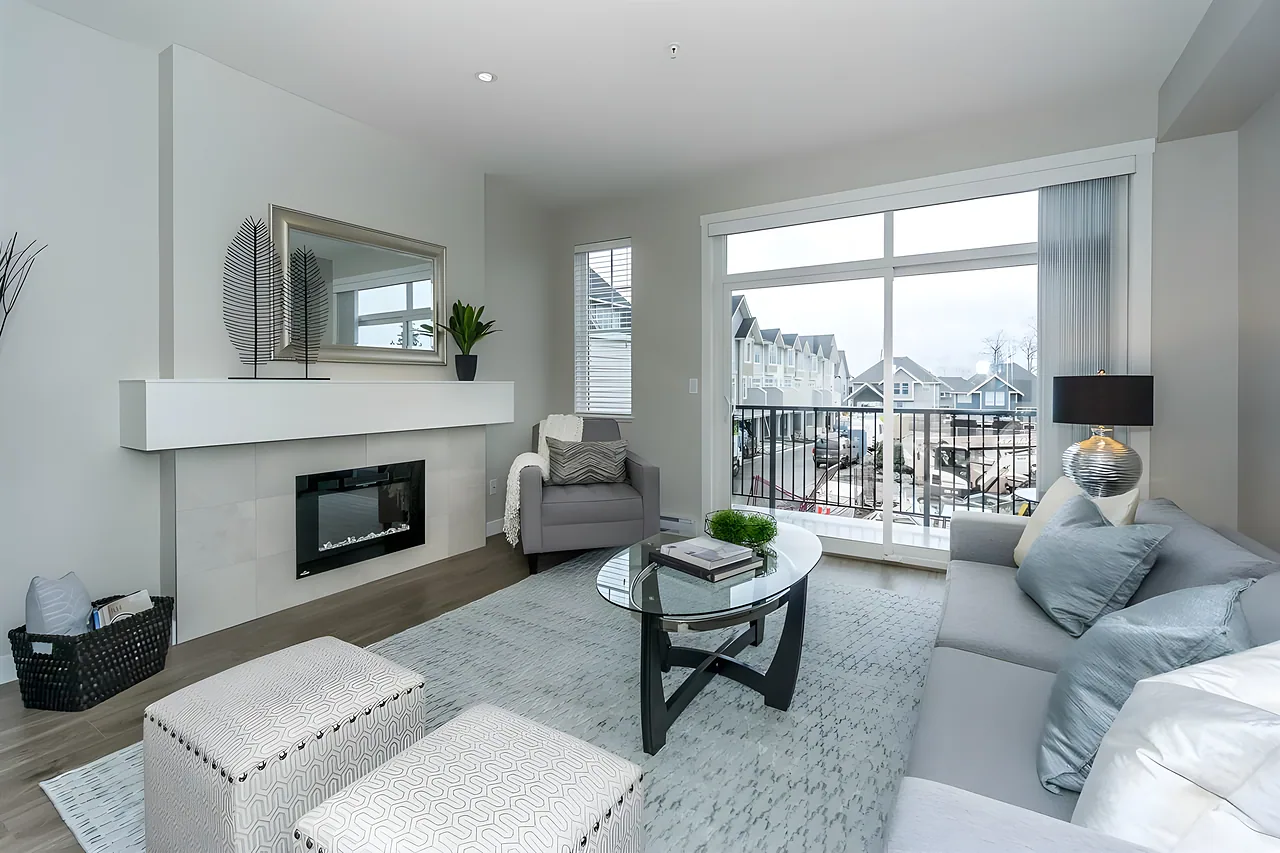 Bright living room with a fireplace and large window