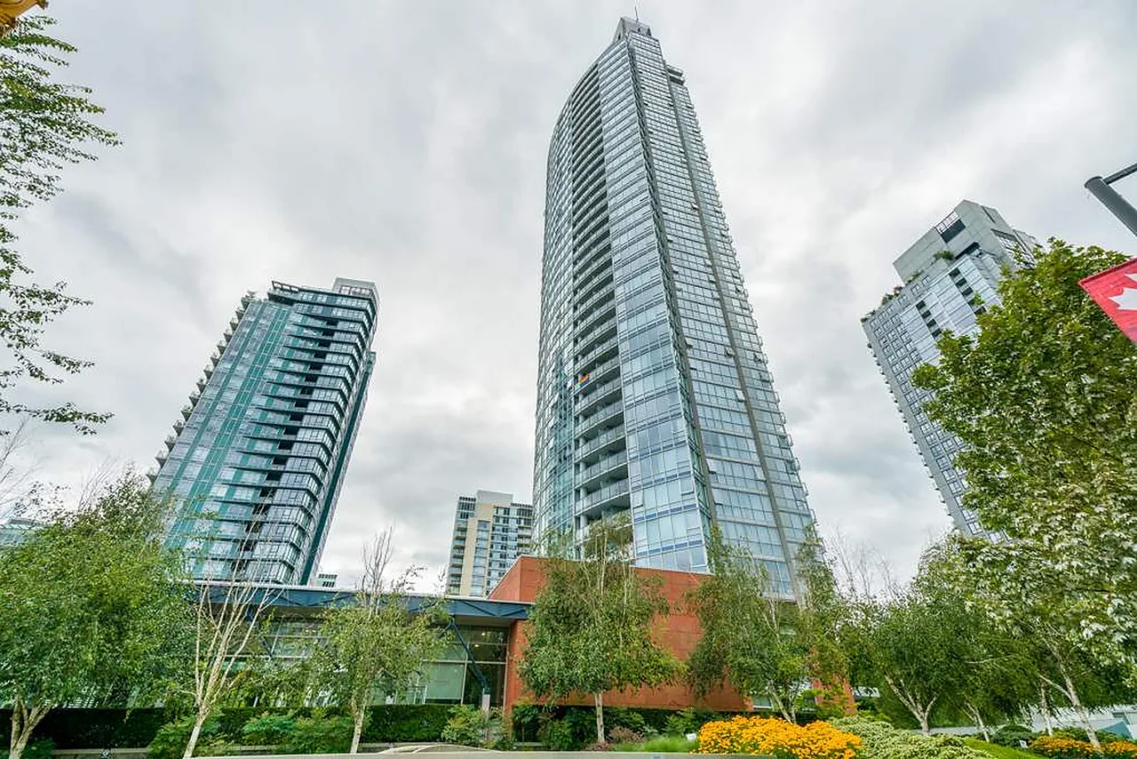 Glass residential towers seen from street level